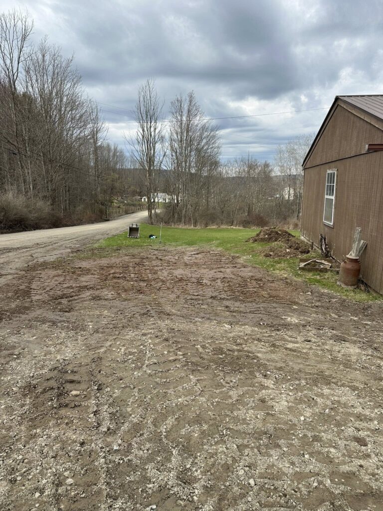 Gravel path beside a brown building